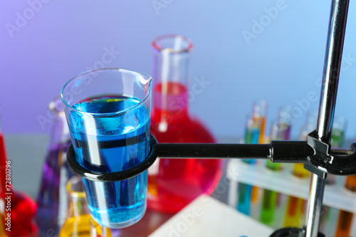 Different laboratory glassware with colorful liquid