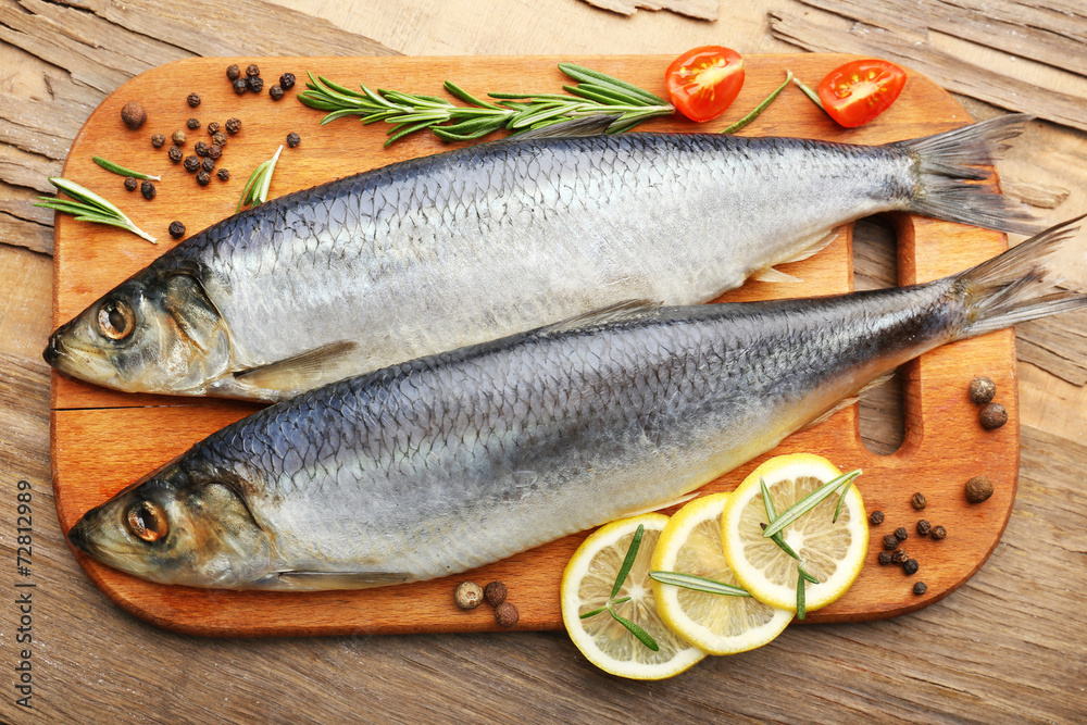 Fresh raw fish and food ingredients on table Fresh raw fish and food ingredients on table