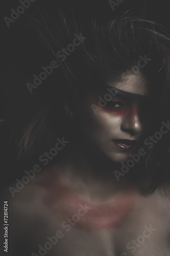 sensual latin woman, red make up in her eyes