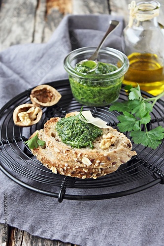 Delicious homemade pesto of green herbs with walnuts