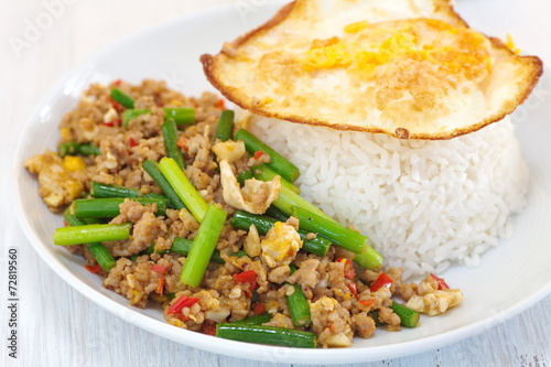 Asian food fried garlic plant and pork with egg