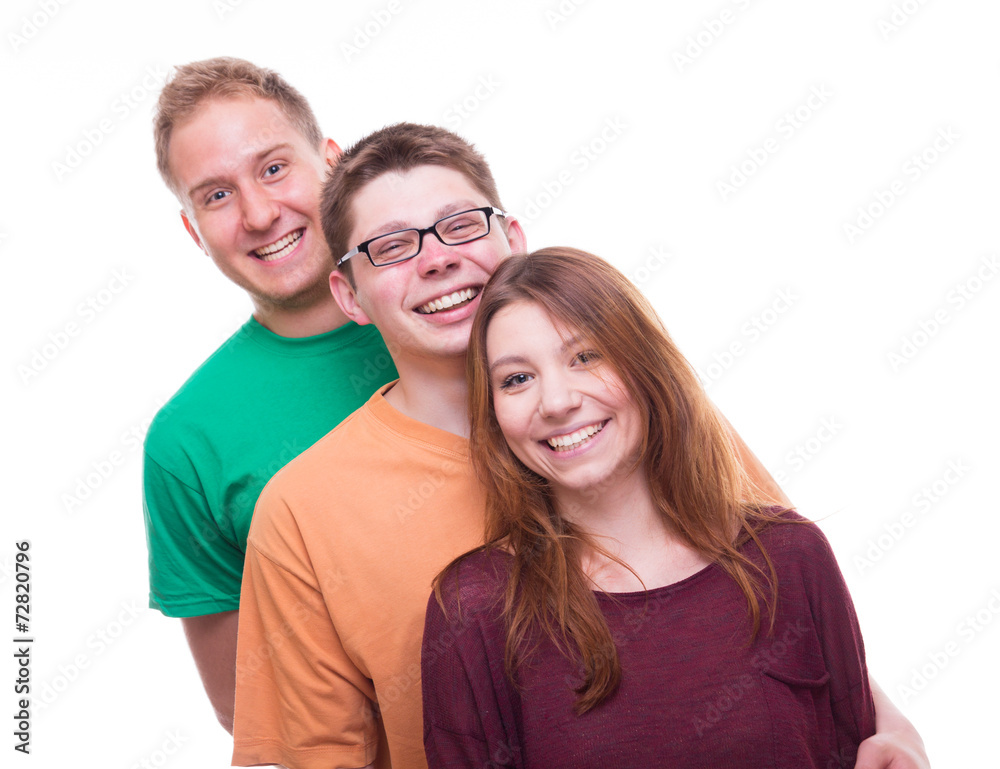 Three Friends standing and laughing - studio shot Three Friends standing and laughing - studio shot