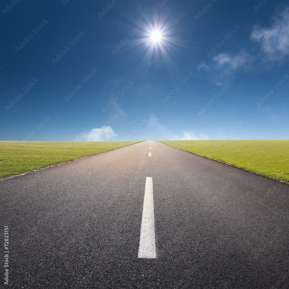 Driving on empty road towards the sun Driving on empty road towards the sun