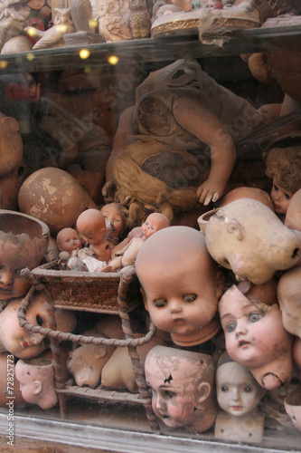 Photography Dolls heads in a window in rome