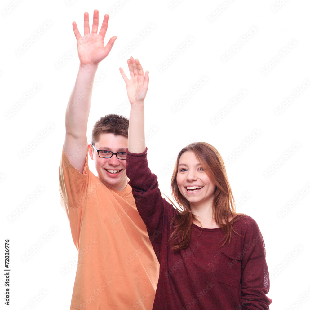 Boy and girl with hands up on white background Boy and girl with hands up on white background