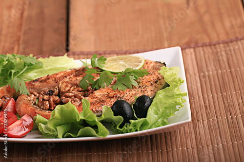 grilled salmon with salad and nuts