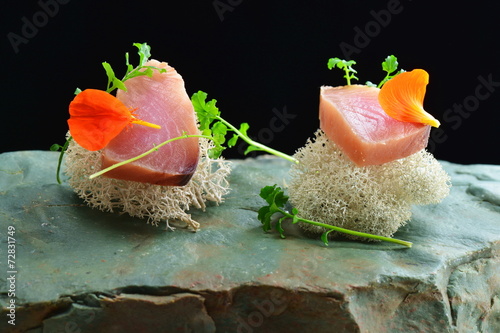 Fine dining, fresh raw ahi tuna sashimi served on sponge