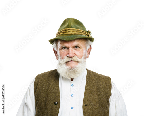Old bavarian man in hat on white background