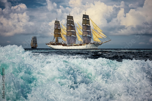 Big wave. Sailing vessel. Large collection of ships and yachts