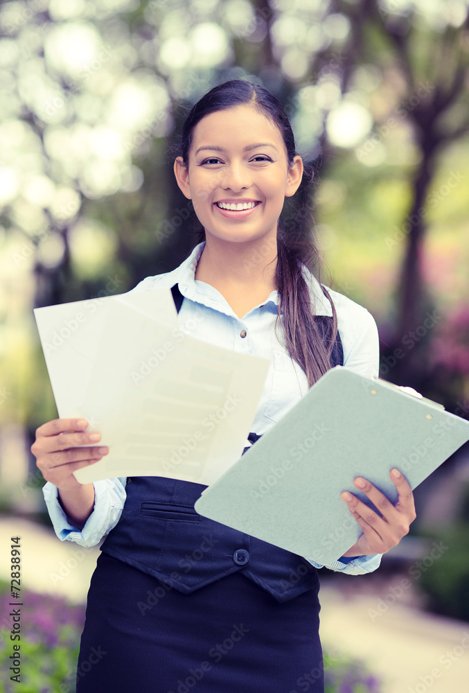 happy young businesswoman reading company documents happy young businesswoman reading company documents