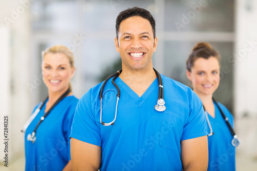 medical doctor with colleagues on background