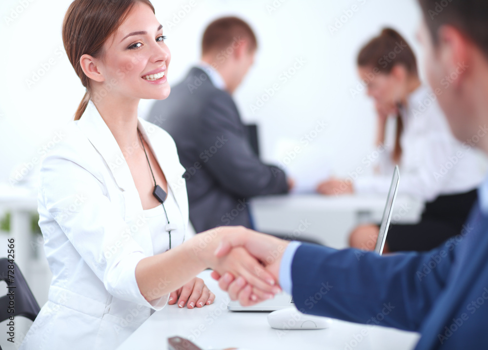 Fototapeta premium Business people shaking hands, finishing up a meeting
