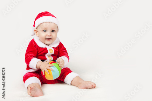 small child dressed as Santa Claus