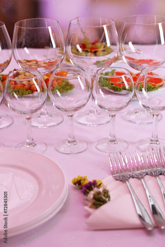 Buffet table with dishware waiting for guests Buffet table with dishware waiting for guests