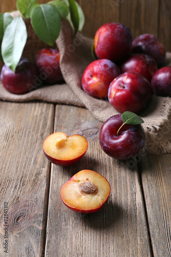 Sweet plums on wooden background