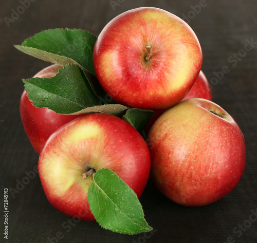 Ripe apples on wooden background