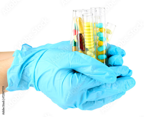 Hand holding test tubes with different color drugs, isolated