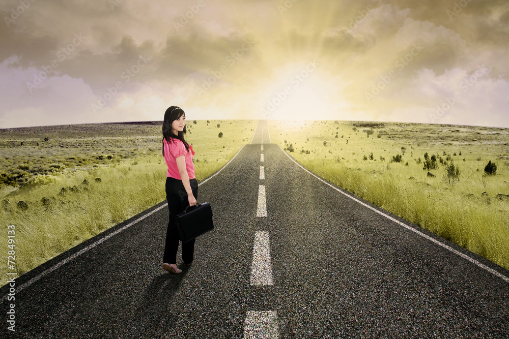Businesswoman standing on the highway road 4