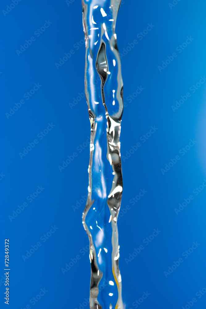 a jet of water on a blue background