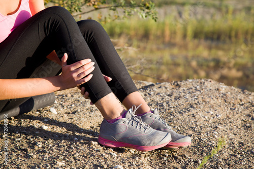 Athletic young woman sprained foot