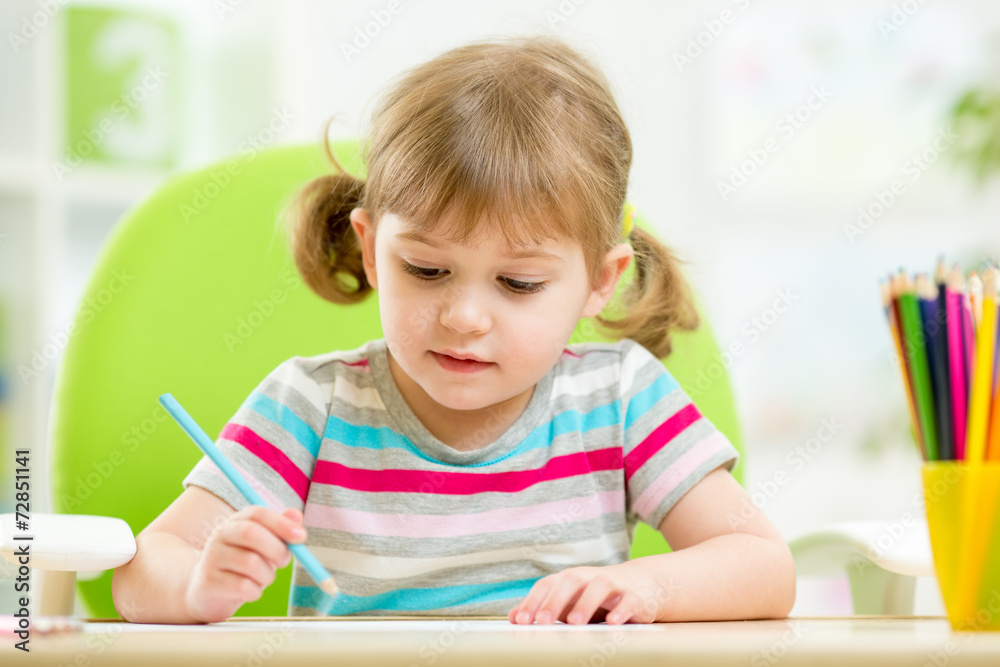 cute little girl drawing with colourful pencils cute little girl drawing with colourful pencils
