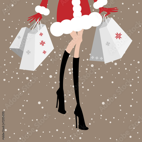 Christmas sale. Shopping fashionable woman with shopping bags.