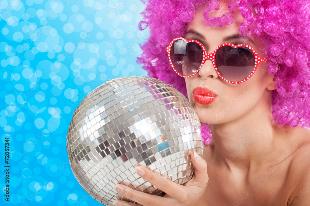 beautiful young girl with a pink wig holding a disco ball Stock Photo |  Adobe Stock