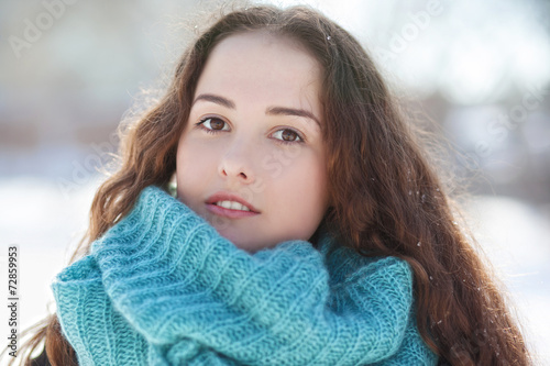 portrait of a beautiful young woman in a scarf