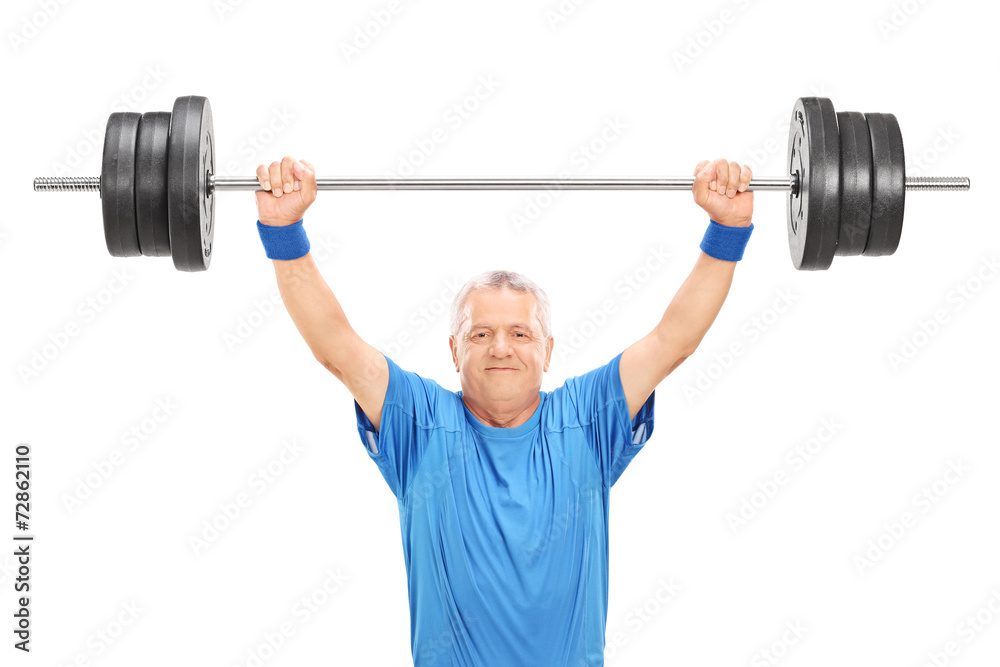 Mature man in sportswear holding a heavy weight Mature man in sportswear holding a heavy weight