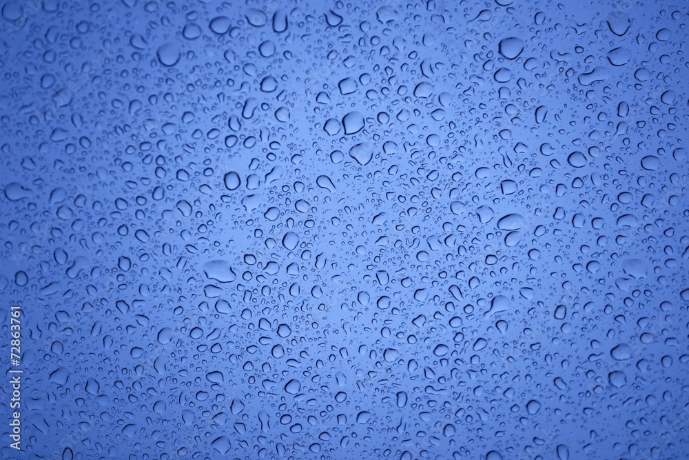 Natural water drops on glass