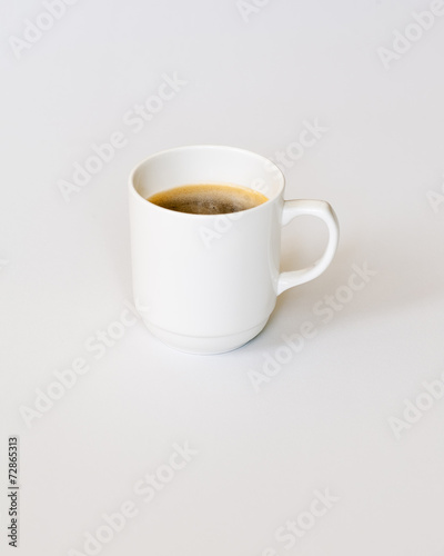 White Cup of Hot Coffee on Gray Background.