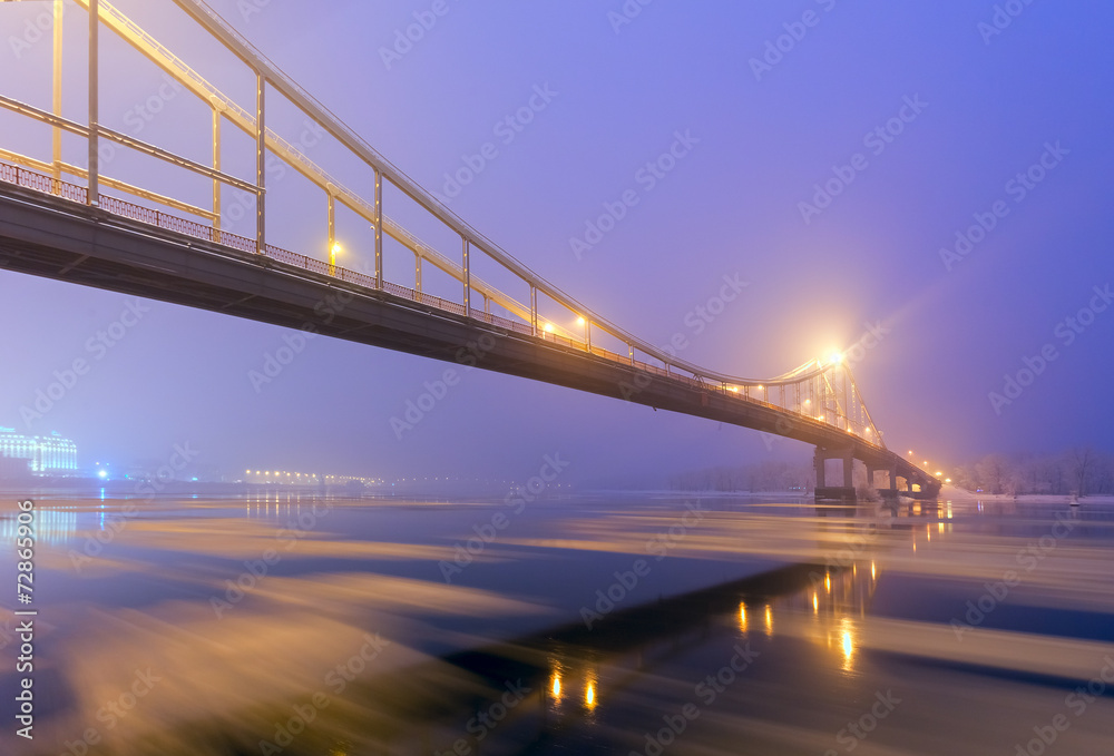 Footbridge in winter Kiev at night