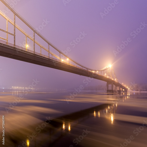 Footbridge in winter Kiev at night