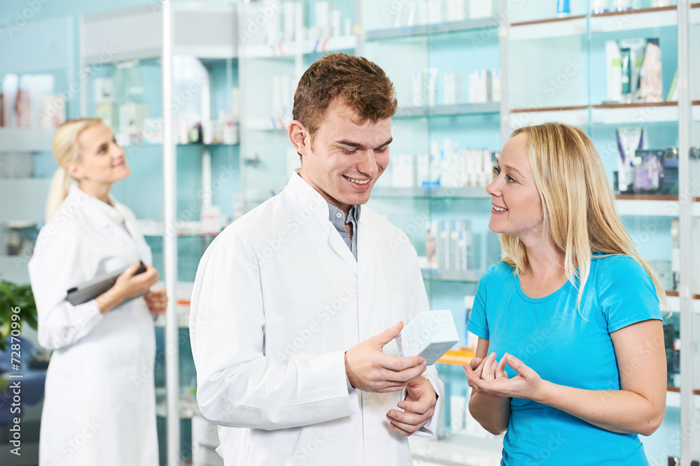 Pharmacy chemist and woman in drugstore