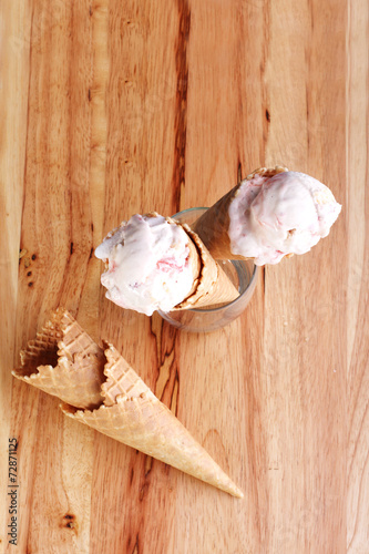 ice cream cones in a glass on wooden background