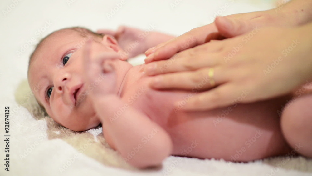 Newborn Baby getting oil massage Newborn Baby getting oil massage