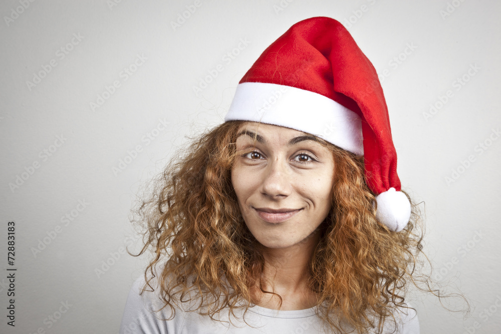 Tired sleepy woman waking up happy with xmas santa hat Tired sleepy woman waking up happy with xmas santa hat