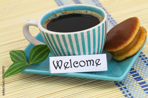 Welcome card with cup of coffee and cookie