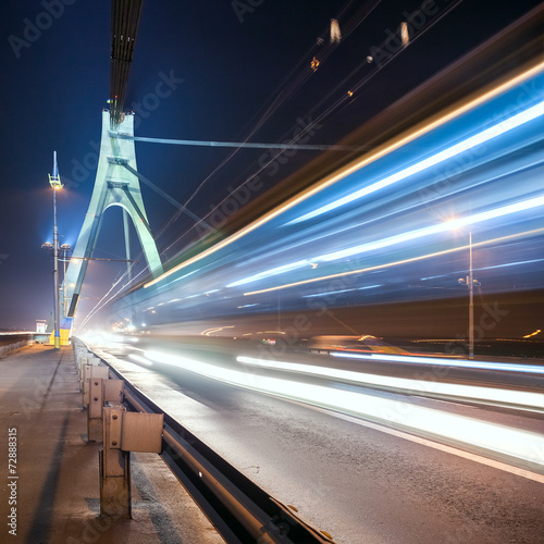 the light trails on the Moscow bridge in Kiev at night