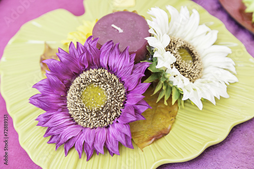 Color flowers and a candle