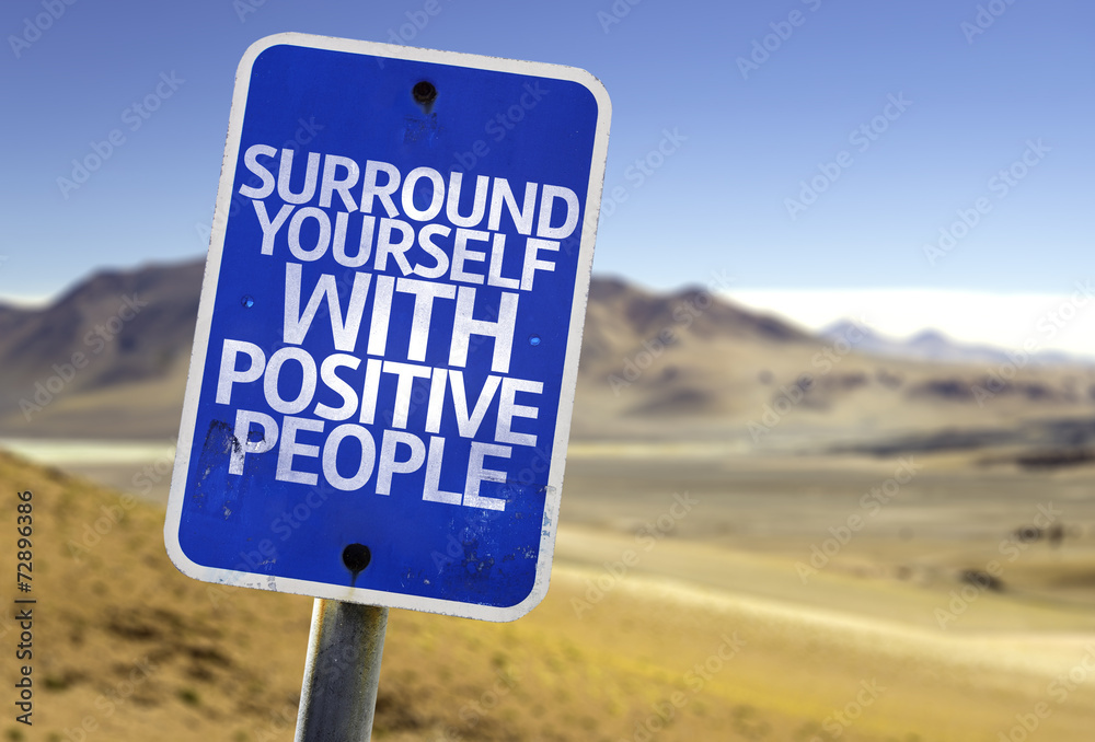 Surround Yourself with Positive People sign with a desert Surround Yourself with Positive People sign with a desert