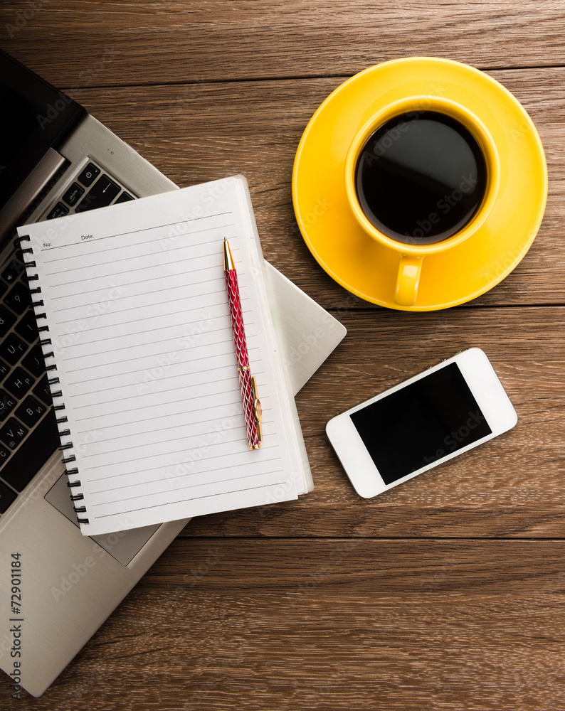 Office desk with devices? notebook and coffee cup. Office desk with devices? notebook and coffee cup.