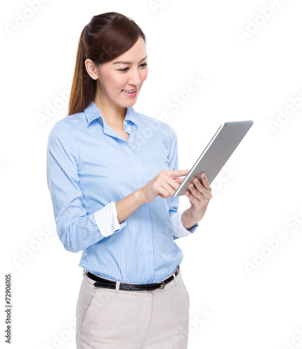 Business woman use of tablet © leungchopan