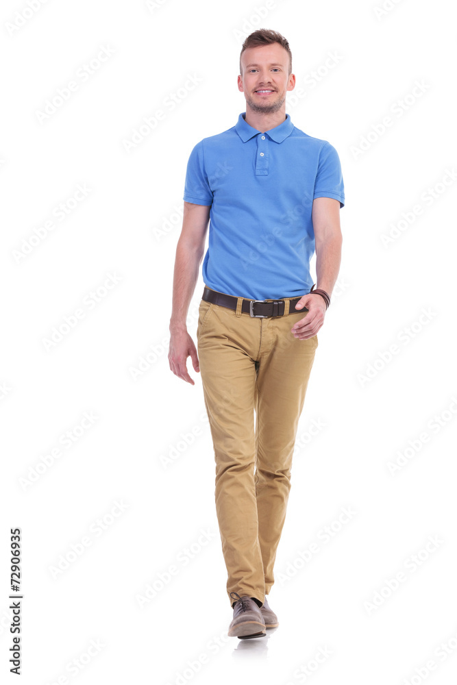 Fototapeta premium casual young man walks toward camera