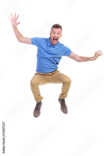 casual young man jumps and screams © Viorel Sima