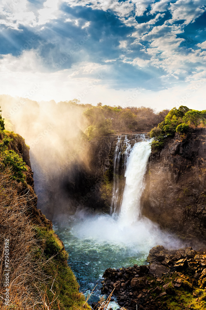 Fototapeta premium The Victoria falls with dramatic sky