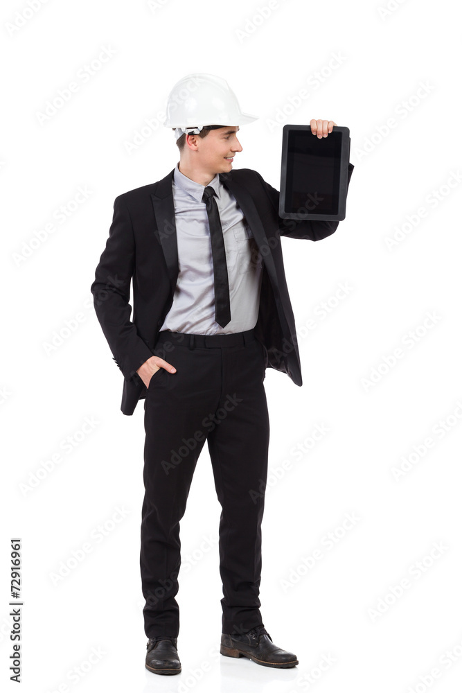 Smiling engineer posing with a digital tablet. Smiling engineer posing with a digital tablet.