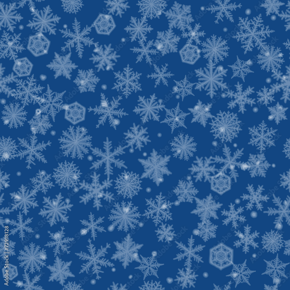Seamless background with beautiful blured snowflakes.