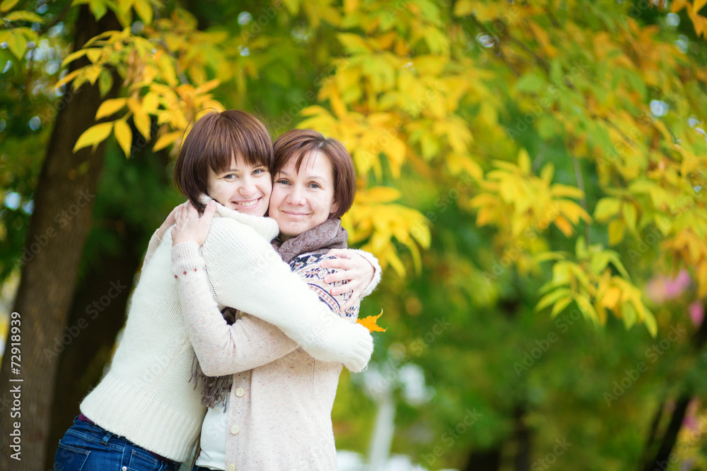 Mother and daughter on a bright fall day Mother and daughter on a bright fall day