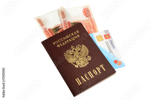 Passport, money and medical insurance policy isolated on white